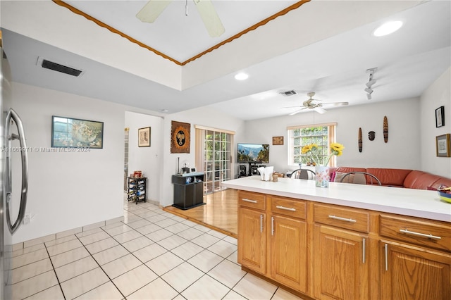 kitchen with ceiling fan and light tile patterned floors