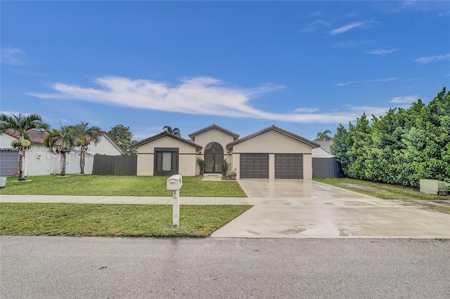 single story home featuring a front yard and a garage