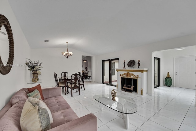 tiled living room featuring vaulted ceiling and a notable chandelier