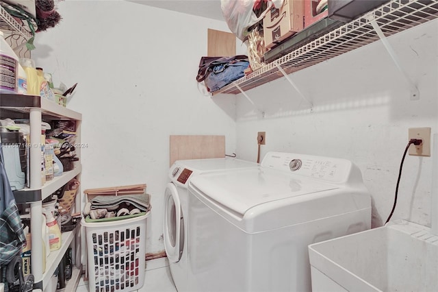 laundry room featuring sink and washing machine and clothes dryer