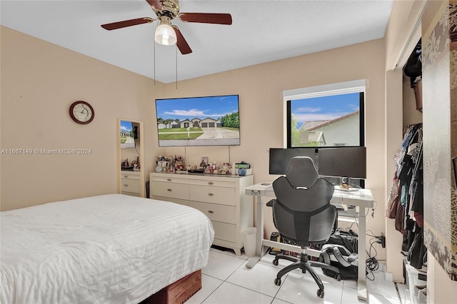 bedroom featuring light tile patterned floors and ceiling fan