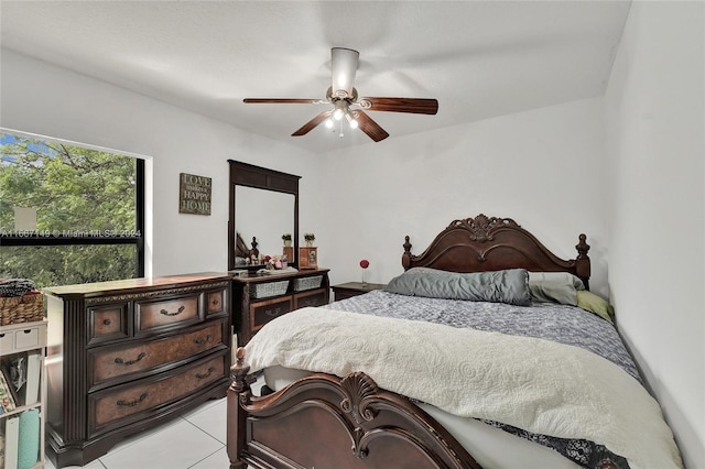 tiled bedroom with ceiling fan