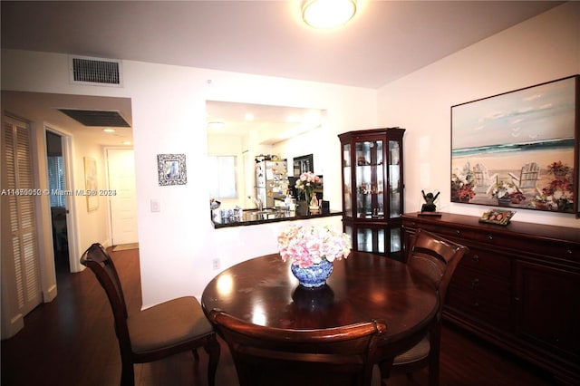 dining room with hardwood / wood-style flooring