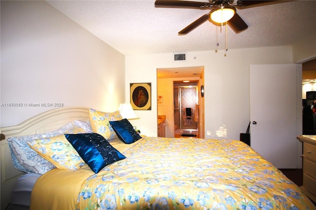 bedroom with ceiling fan and a textured ceiling