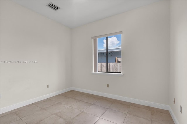 spare room with light tile patterned floors