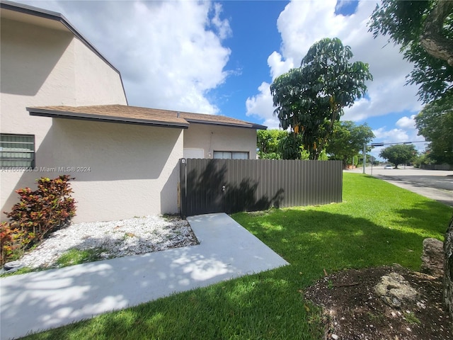 view of property exterior featuring a yard