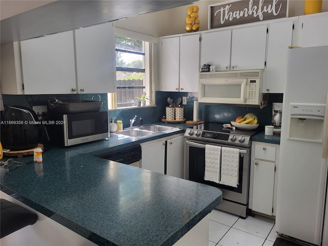 kitchen featuring light tile patterned floors, backsplash, white cabinetry, sink, and stainless steel appliances