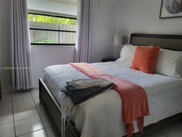 bedroom with light tile patterned floors