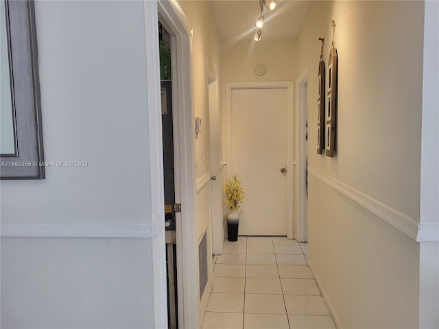 hallway featuring light tile patterned floors