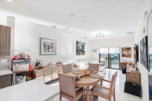 4636 NW 84th Ave Unit 47, Doral, FL 33166 - dining room featuring visible vents and light tile patterned floors