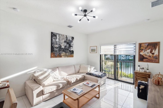 4636 NW 84th Ave Unit 47, Doral, FL 33166 - living area with visible vents, an inviting chandelier, and light tile patterned floors