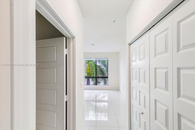 corridor with tile patterned flooring