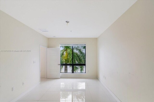 empty room with light tile patterned floors