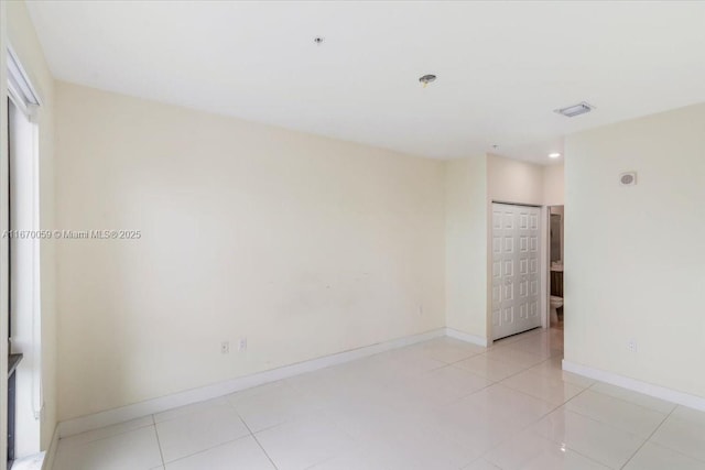 empty room featuring light tile patterned flooring