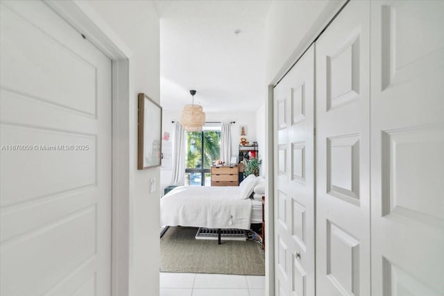 bedroom featuring light tile patterned floors