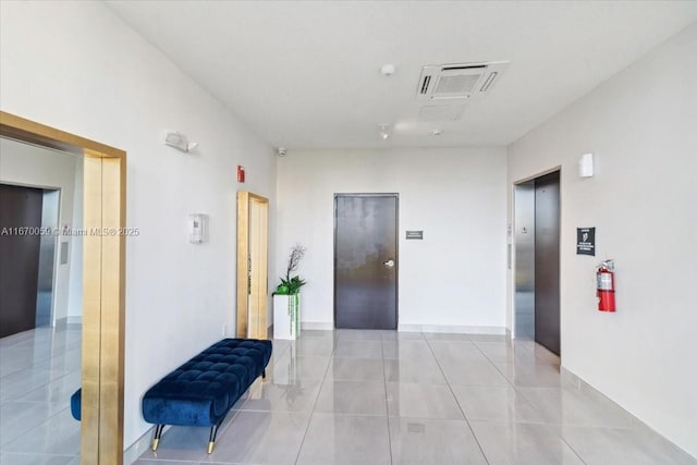 4636 NW 84th Ave Unit 47, Doral, FL 33166 - hall with elevator, light tile patterned floors, and visible vents