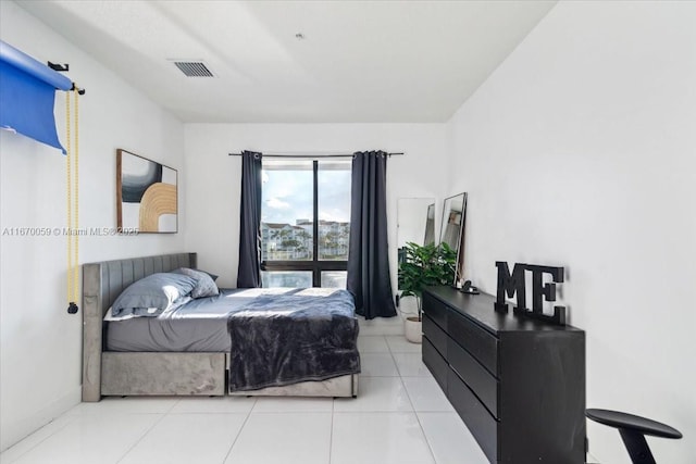 bedroom featuring light tile patterned flooring