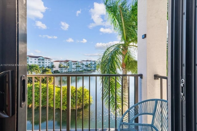 balcony featuring a water view