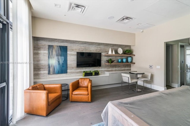 4636 NW 84th Ave Unit 47, Doral, FL 33166 - living room with visible vents, baseboards, and wood finished floors