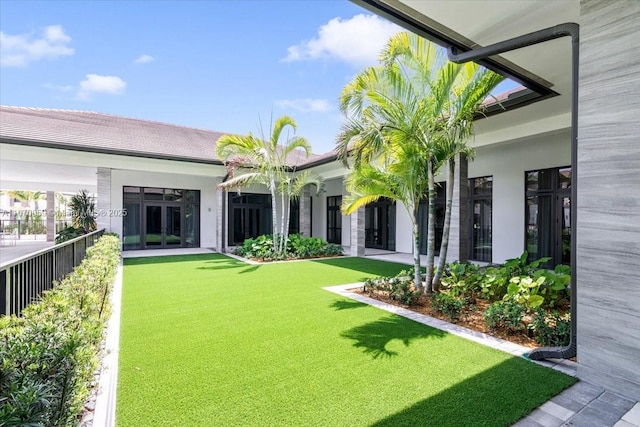 view of yard with french doors