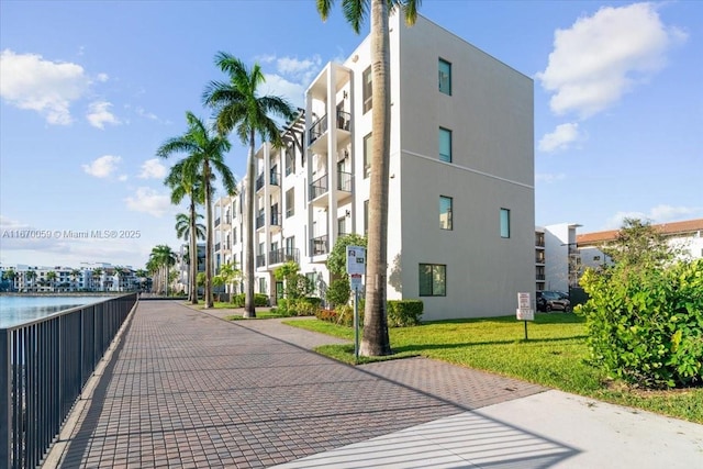 view of building exterior with a water view