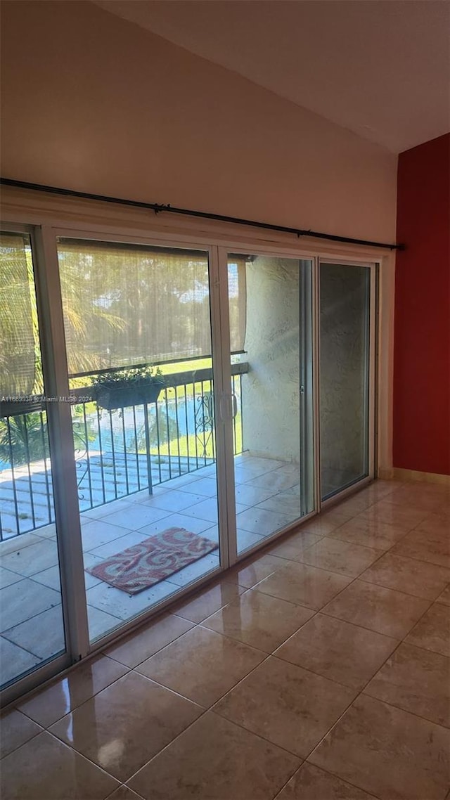 doorway to outside featuring tile patterned floors