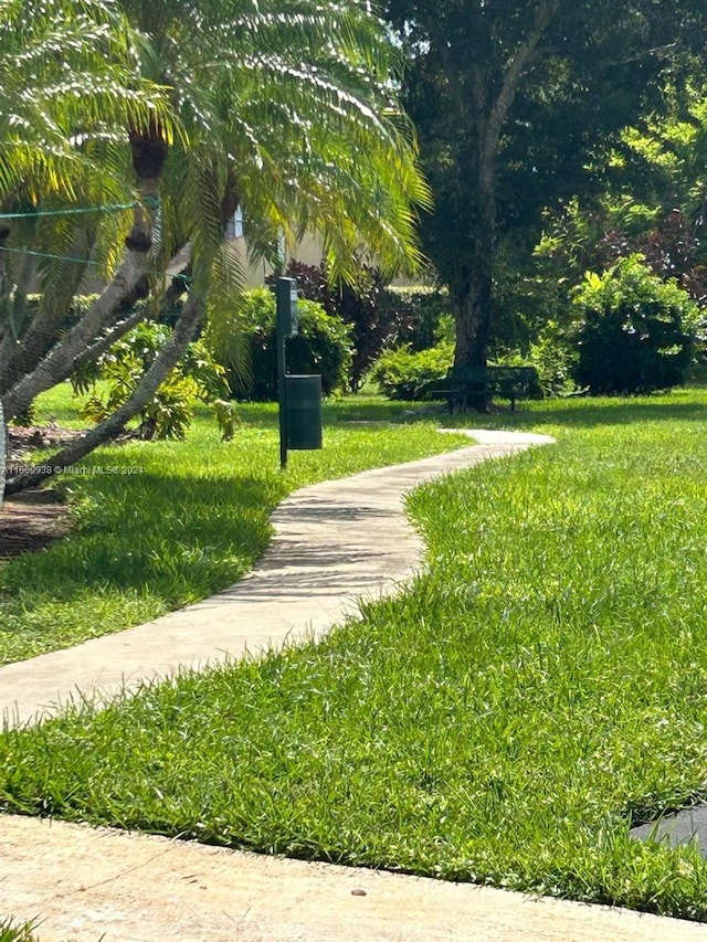 view of home's community with a lawn