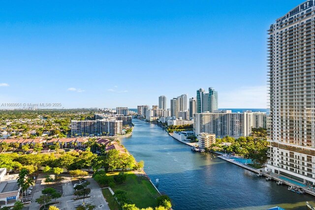 exterior space with a water view and a view of city