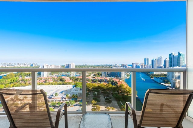 balcony with a view of city and a water view