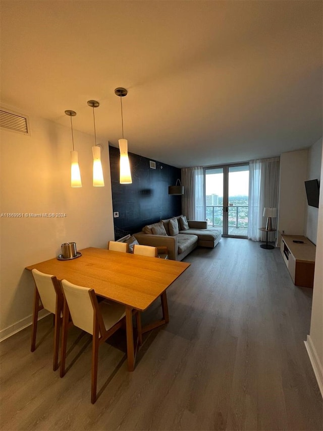 dining space featuring french doors and dark wood-type flooring