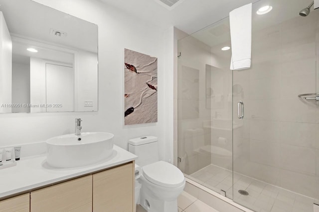 bathroom featuring visible vents, toilet, a stall shower, recessed lighting, and vanity