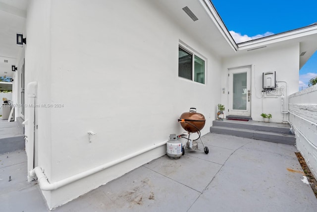 doorway to property featuring a patio