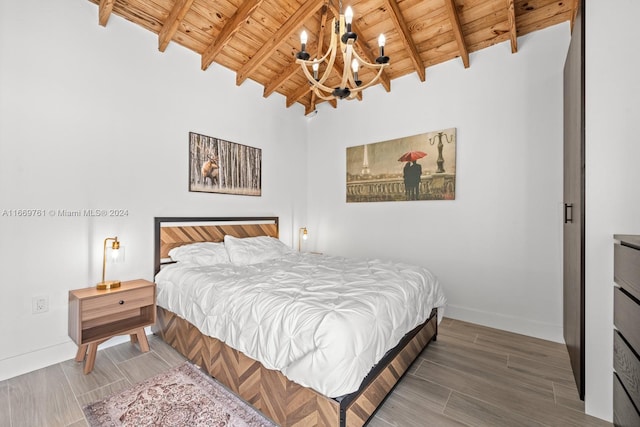 bedroom featuring wood-type flooring, vaulted ceiling with beams, a chandelier, and wooden ceiling