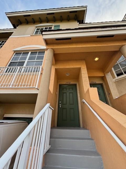 doorway to property with a balcony