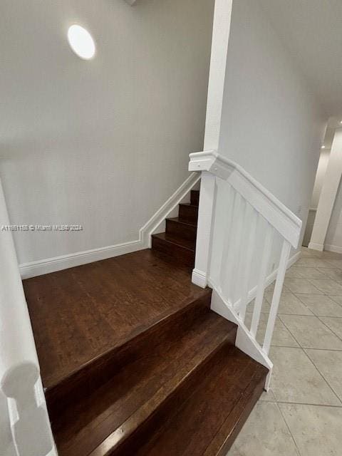 stairs featuring hardwood / wood-style flooring