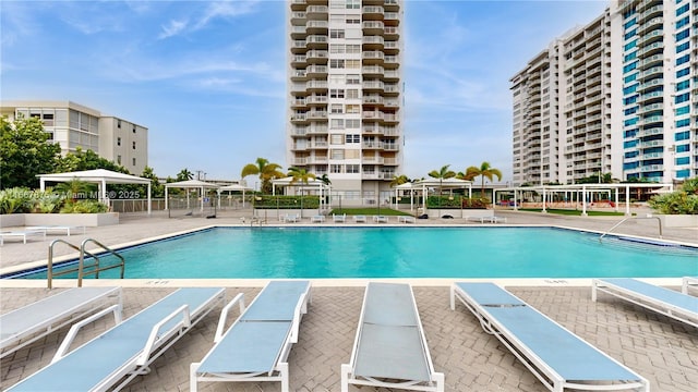 view of swimming pool with a gazebo and a patio