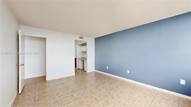 unfurnished bedroom featuring light tile patterned floors