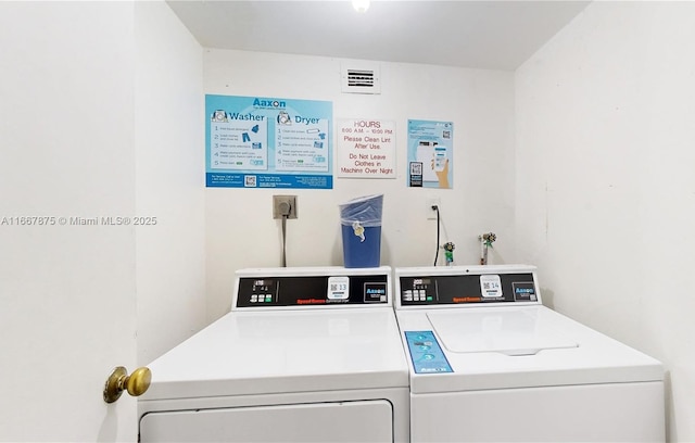 laundry room featuring washing machine and dryer