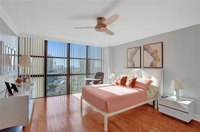 bedroom featuring access to outside, ornamental molding, ceiling fan, and light hardwood / wood-style flooring