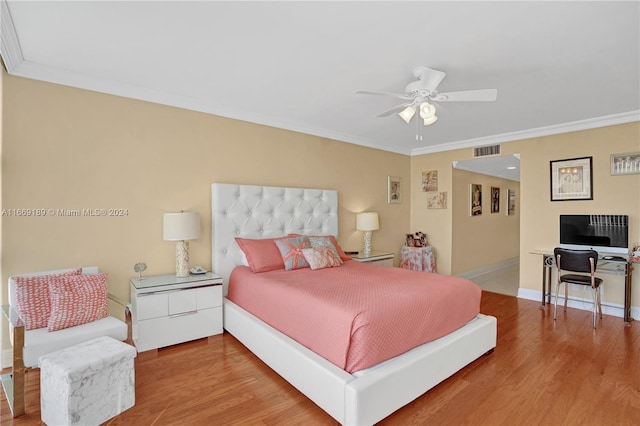 bedroom featuring crown molding, hardwood / wood-style floors, and ceiling fan