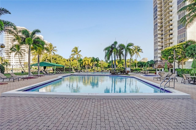 view of pool featuring a patio and a gazebo