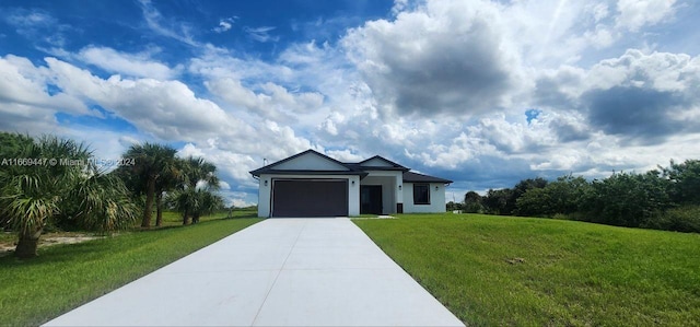 ranch-style house featuring a garage and a front lawn