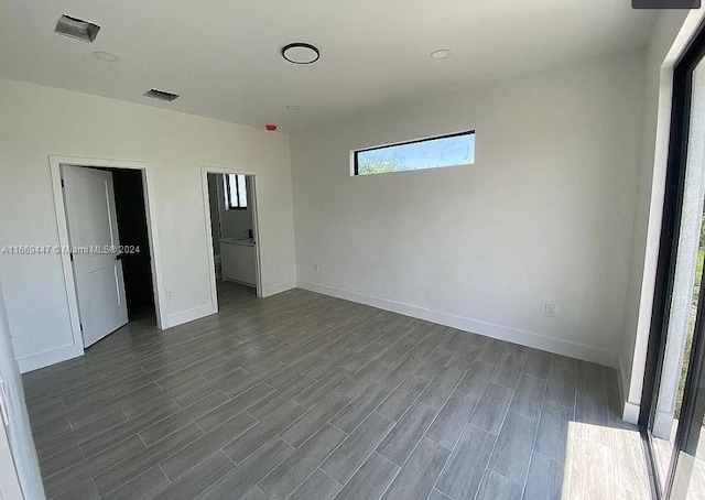 unfurnished bedroom featuring dark hardwood / wood-style floors