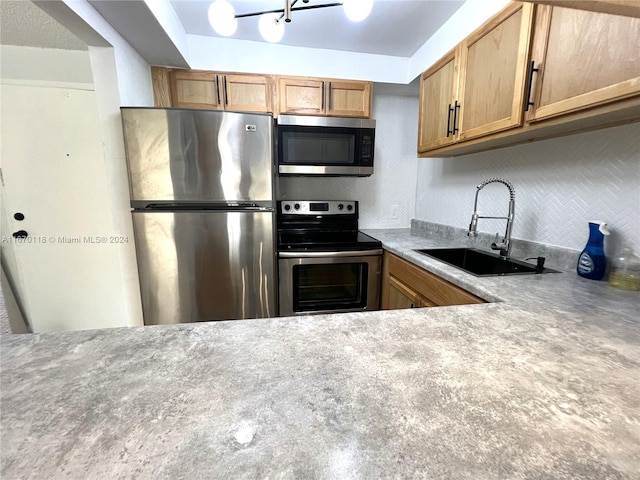 kitchen featuring stainless steel appliances and sink