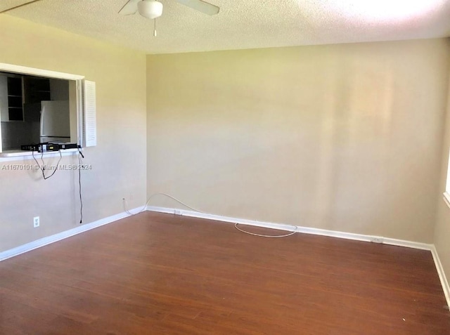 unfurnished room featuring a textured ceiling, hardwood / wood-style flooring, and ceiling fan