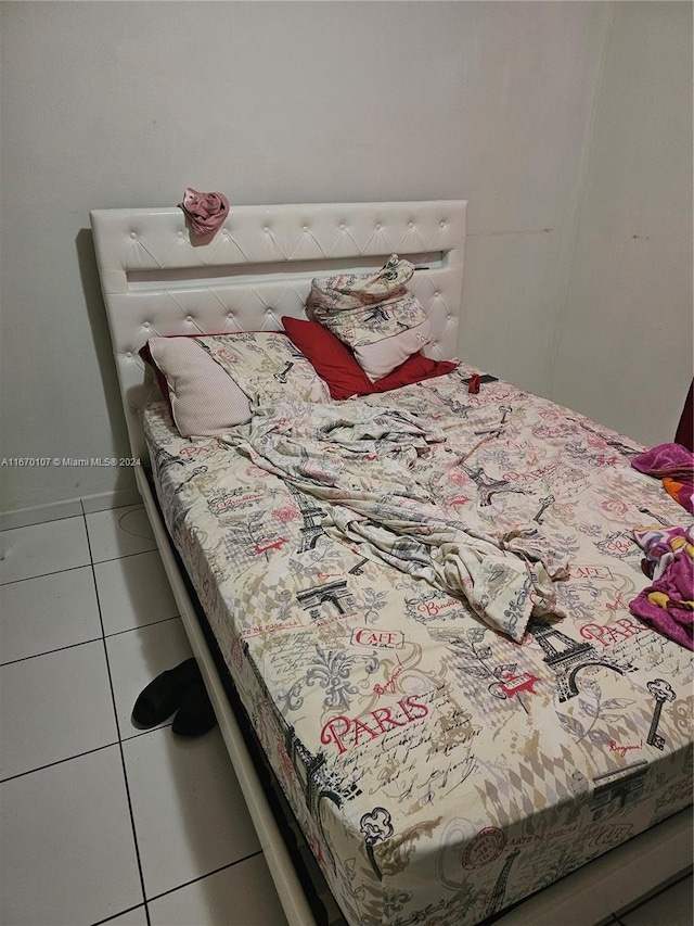 bedroom featuring light tile patterned floors