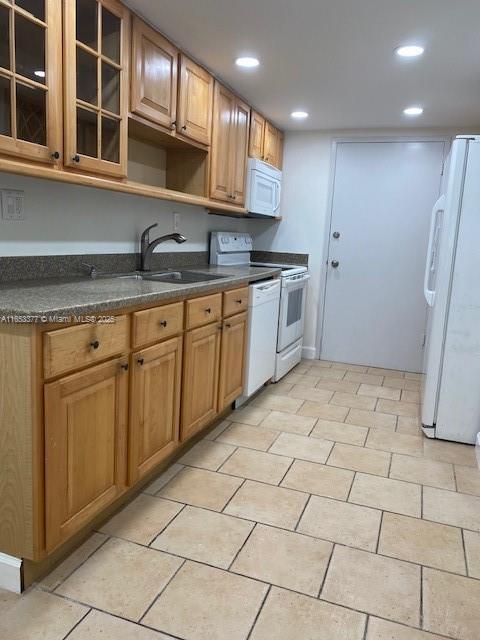 kitchen with sink and white appliances