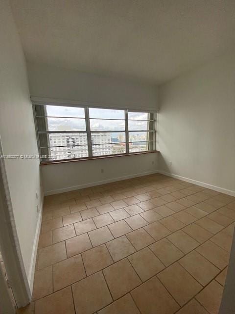 view of tiled spare room