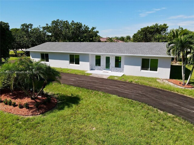 exterior space with a front lawn