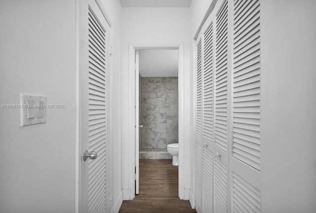 hall with dark wood-type flooring